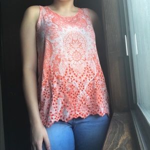 Sleeveless orange and white top